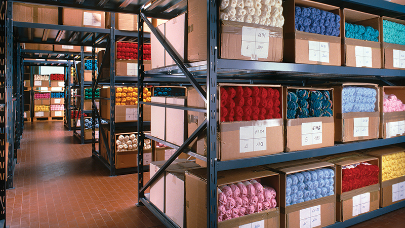 Intradeco Apparel Case Study, picture of warehouse shelves holding colorful yarn
